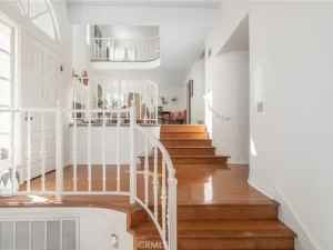 wooden staircase and white railings,