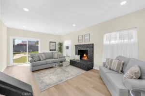 living room with beige walls and light wood flooring