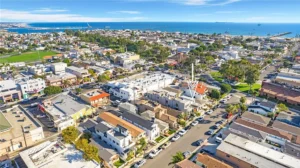 Aerial view of a coastal town with a mix of residential and commercial buildings in California