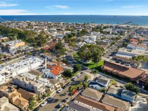Aerial view of a coastal town with a mix of residential and commercial buildings in California